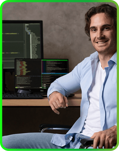 Web developer smiling in front of their coding environment