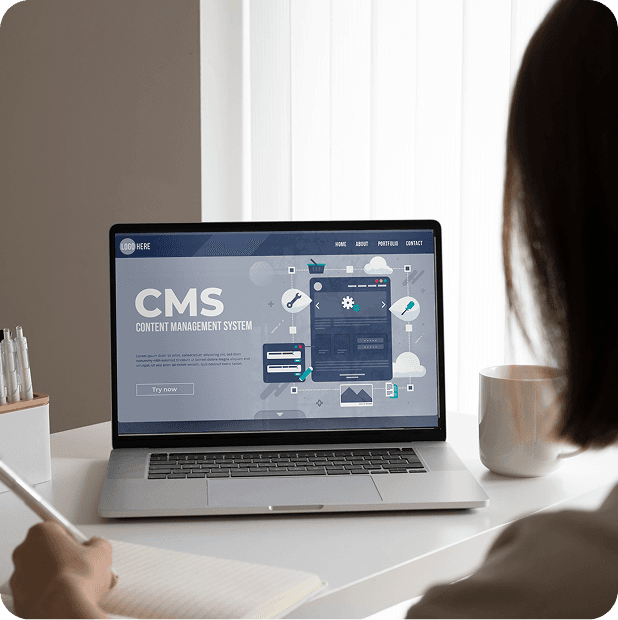 WordPress CMS admin screen on a laptop
