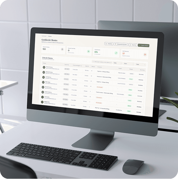 Monitor showing a CRM with a customer list and sales metrics on an office desk