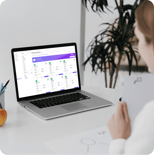 Person using a laptop with a SaaS business management platform