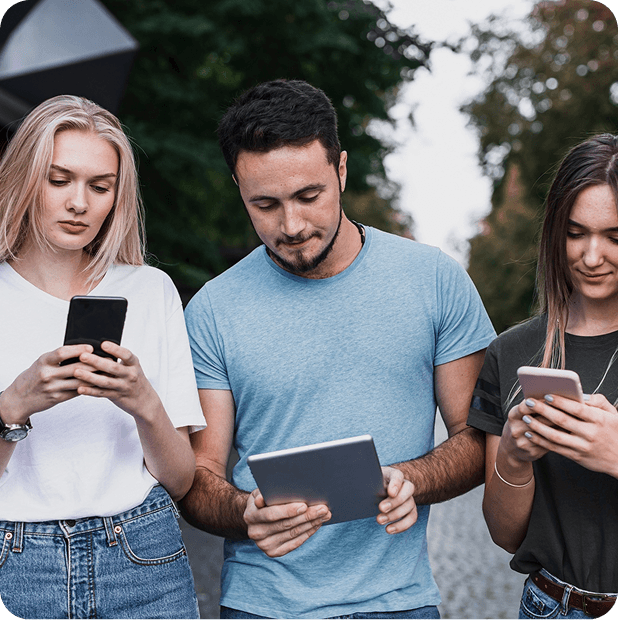 Three users reviewing a newly launched mobile app MVP on their phones